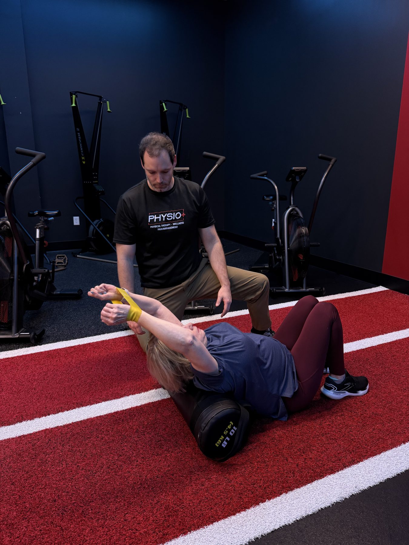Ankle taping on the indoor track at Physio+